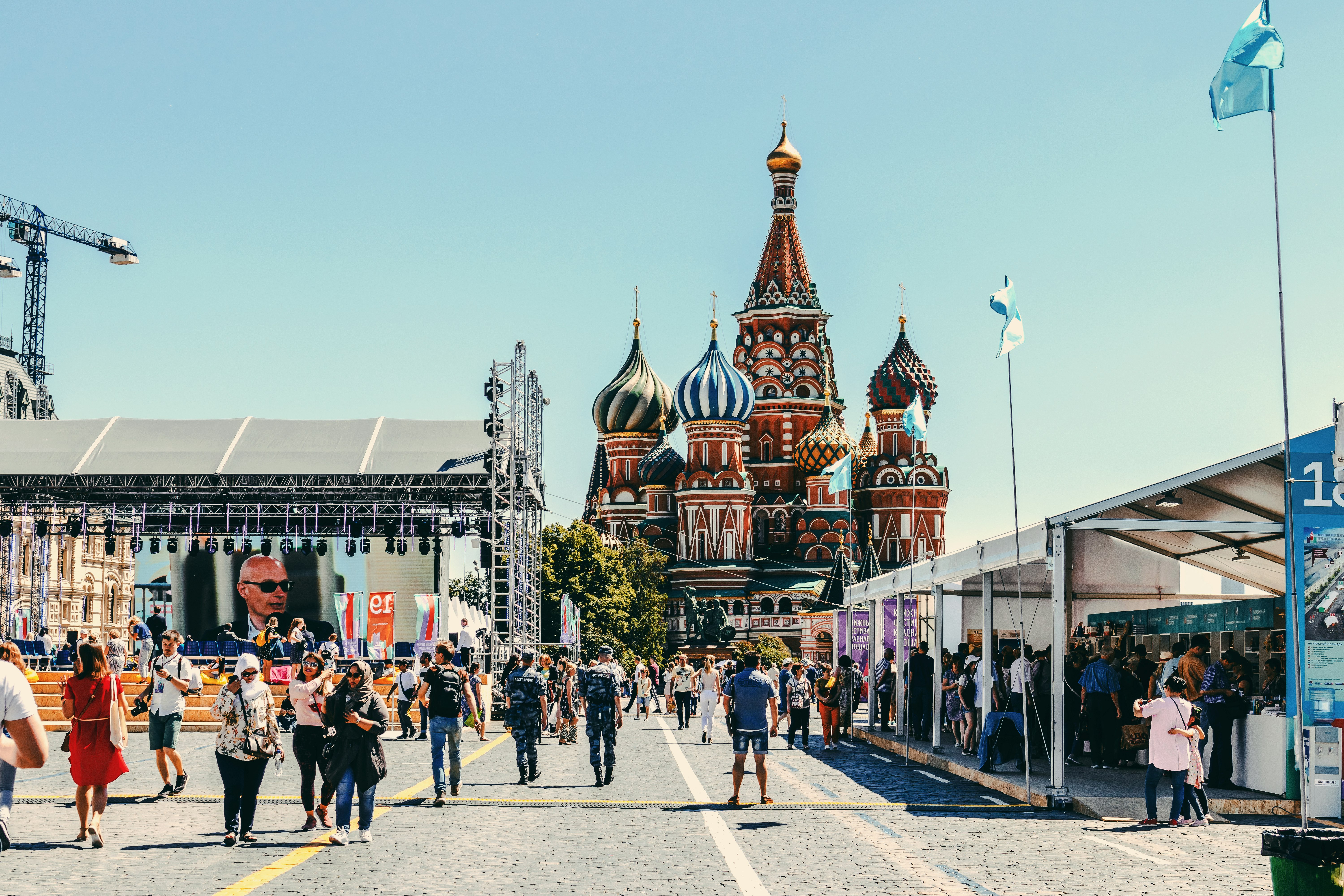 people standing near concrete buildings during daytime